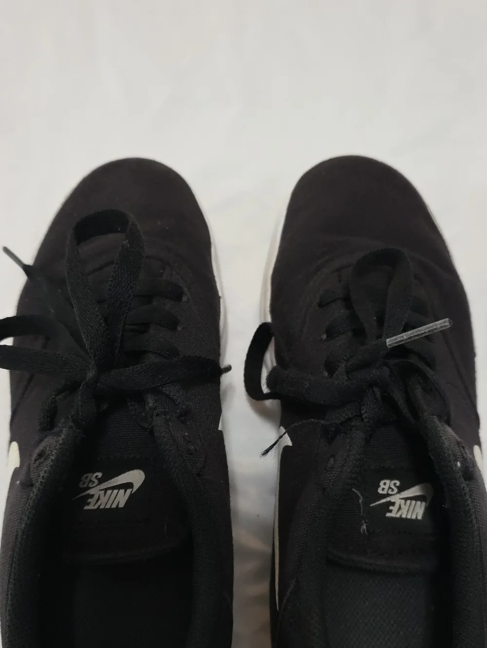 Nike Black Low-Top Sneakers with White Swoosh
